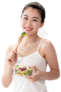 塑身内衣满意亚洲放松青年女人吃沙拉背景