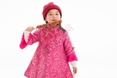 节日童年文化欢乐的小女孩吃糖葫芦图片