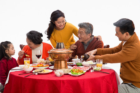 东方人女孩幸福家庭过年吃团圆饭女儿高清图片素材