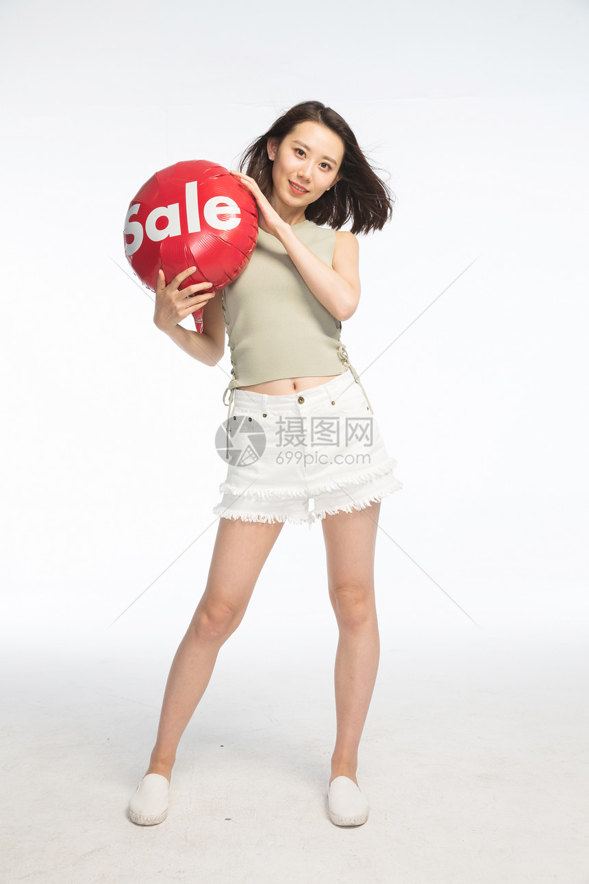 人摄影快乐年轻女孩拿着气球图片