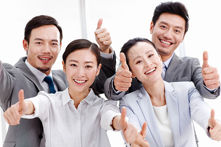 微笑亚洲商务关系东方商务团队翘起大拇指团结高清图片素材