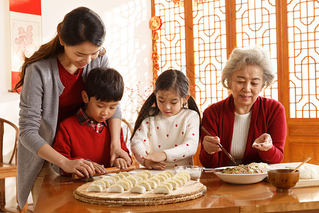 吃饺子的小孩20多岁元素亲情幸福家庭过年包饺子背景