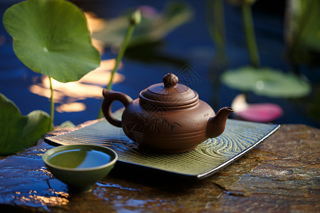 池塘月色茶杯茶具背景