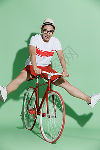 骑独轮活力影棚拍摄青年男人骑自行车背景