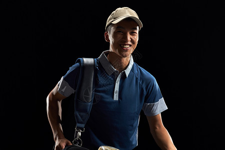 黑色背景体育器械高尔夫球运动员图片