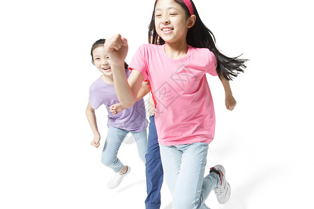 影棚拍摄10岁到11岁关爱欢乐的小学生奔跑小学男生高清图片素材