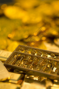 金算盘和黄金货币高清图片素材