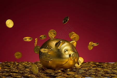 金融储蓄存钱罐和金币红色背景高清图片素材