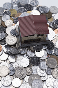 赚钱东亚硬币硬币和房屋模型高清图片