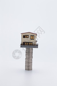 财务金融硬币和房屋模型图片