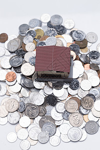硬币和房屋模型背景图片