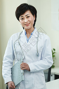 治病保护工作服东方人医务工作者在办公室背景图片