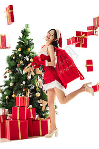 美女圣诞装饰物东方人穿着圣诞服的年轻女人和圣诞礼物图片