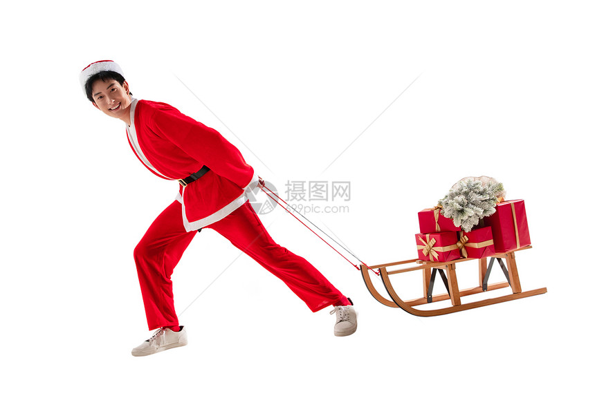 传统节日松针青年男人拉着圣诞礼物的年轻男人图片