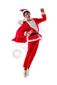 青年人红色享乐穿圣诞服的青年男人背着礼物袋高清图片