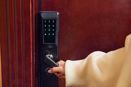 智能家居按钮女性回家使用电子密码开门背景