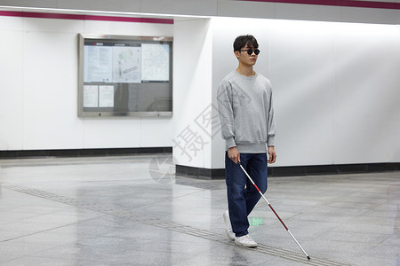 世界滑板日海报视障青年走盲道坐地铁背景