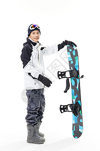 男青年拿着滑雪板图片