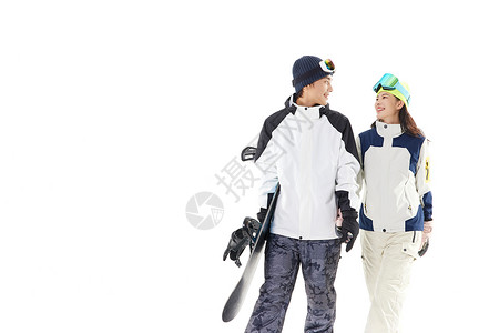 年轻情侣牵手滑雪约会图片