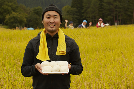 农业工作者水稻米丰收笑容高清图片素材