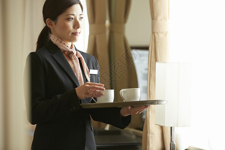 客气的30多岁人类在酒店工作的女红茶高清图片素材