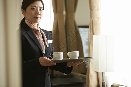 谦恭的客栈西服在酒店工作的女职业高清图片素材