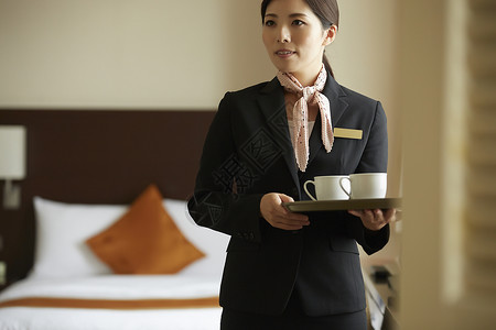 雇员好客明亮在酒店工作的女商业高清图片素材