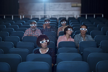 立体的坐着努力获取观众观看3d电影爱好高清图片素材