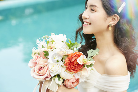 彩虹婚礼素材手捧鲜花的美丽新娘背景