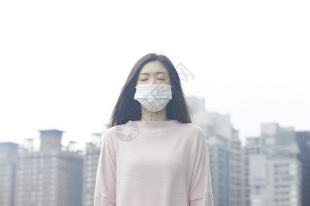 雾霾天气女人戴口罩图片