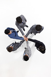 商务团队搭手团结合作俯拍背景图片