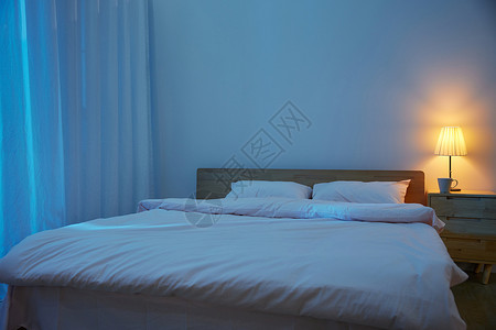 蓝色暖调夜晚的简约家居卧室背景