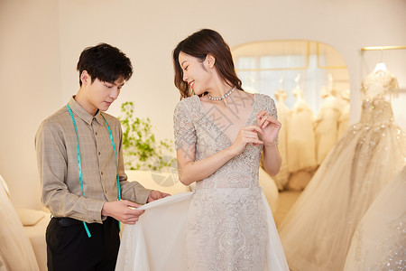 婚纱设计师为新娘定制婚纱服装高清图片素材