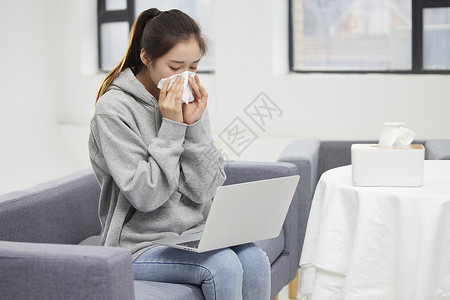 冬天雾霾室内过敏擦鼻涕的女性背景