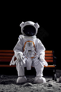 创意宇航员坐在长椅上研发高清图片素材