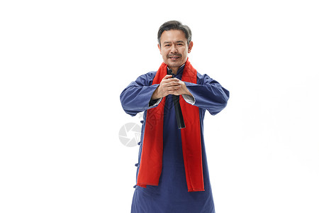 男性相声演员戴红围巾拜年作揖图片