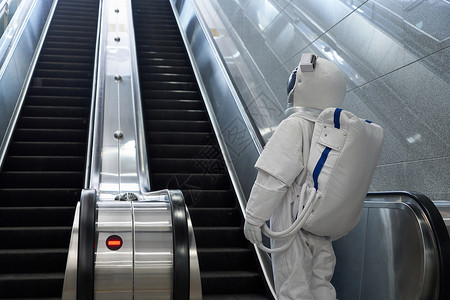 宇航员乘坐地铁电梯形象背景图片