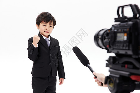 儿童节表演节目镜头前的小记者录制节目背景