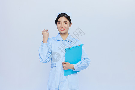 年轻美女护士加油手势图片
