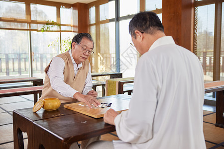 围棋教育老人聚会时一起下棋背景