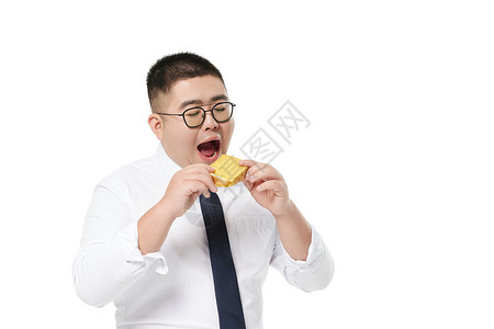 中年商务胖男士吃面包糖尿病日高清图片素材