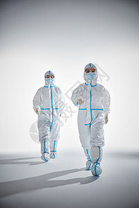 穿防护服向前走的医护人员形象背景图片