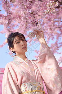 日系清新和服美女手扶着樱花图片