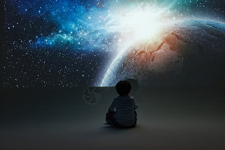 坐在地上探索宇宙奥秘的小男孩背景