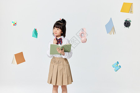 漂浮的文具和小女孩背景图片