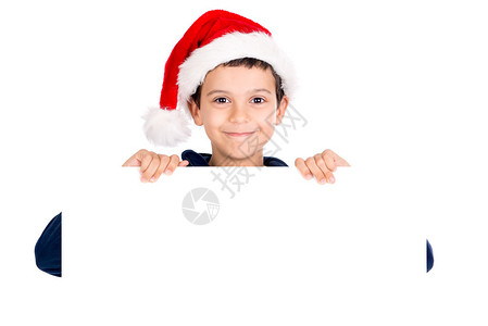 带着圣诞老人帽子的快乐小男孩图片