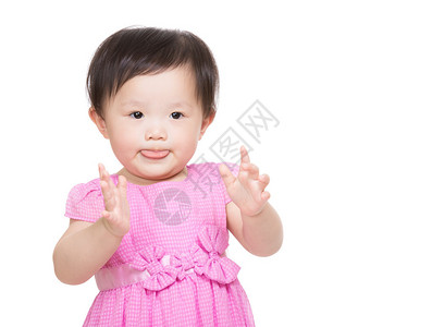 亚洲女婴做脸和鼓掌图片
