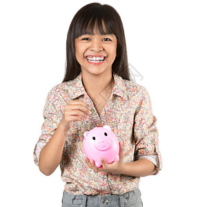 快乐的亚洲小女孩小猪银行图片