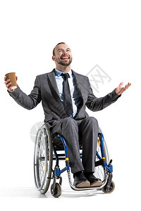 残疾商人乘坐轮椅用咖啡将图片
