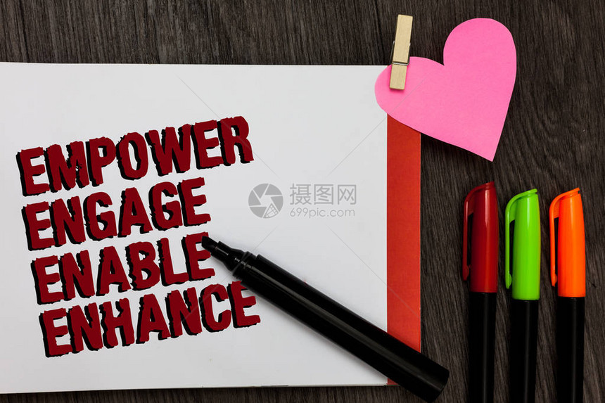 显示EmpowerEngageEnableEnhance的书写笔记商业照片展示授权领导动机参与页面上的粗体红字笔小心脏图片